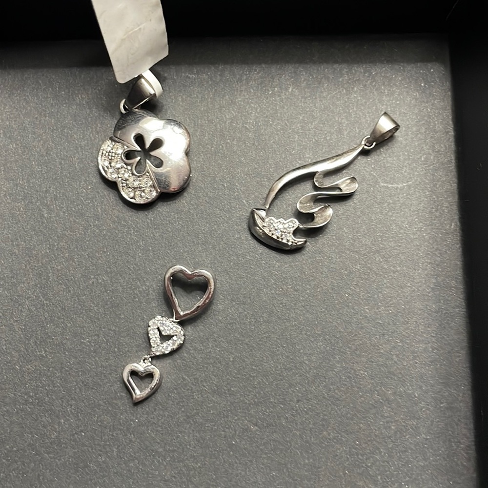 Set of silver charms.